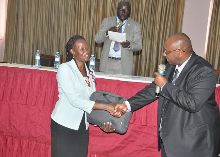 The Permanent Secretary of the Ministry of Local Government, Mr. Ben Kumumanya (right), officially hands over a laptop to a district officer during a handover ceremony aimed at strengthening planning and audit functions at the district level. (Photo: @MoLGUganda)