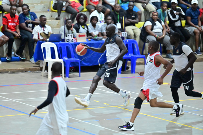Action moment as Uganda, dressed in black and white, battle Kenya in their white-and-red